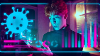 Young man interacting with a futuristic digital interface showing coronavirus data and statistics.