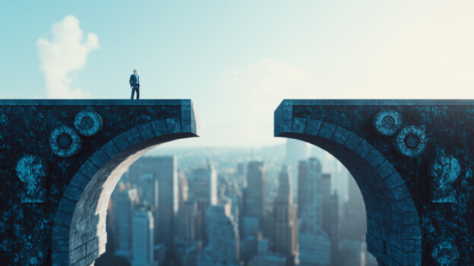 A lone businessman stands on the edge of a broken stone bridge high above a sprawling cityscape, symbolizing a gap or challenge.
